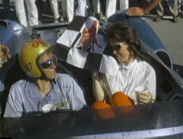 Racer Dave MacDonald sits in King Cobra with wife Sherry - 1963 LA Times Grand Prix